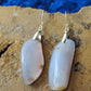  The bail and earring wires are authentic 925 sterling silver.  Wear these original earrings and stand out in a crowd!  Known as the Treasure State, Montana’s landscape is an abundant resource for precious and semi-precious stones.  One of the semi-precious stones, Madison Blue Agate, are featured in these earrings.  