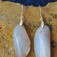  The bail and earring wires are authentic 925 sterling silver.  Wear these original earrings and stand out in a crowd!  Known as the Treasure State, Montana’s landscape is an abundant resource for precious and semi-precious stones.  One of the semi-precious stones, Madison Blue Agate, are featured in these earrings.  