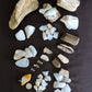 1 large petrified wood (rough) $19.75  1 beautiful madison blue agate specimen with pockets covered in botryoidal mini crystals, $22  1 madison blue agate key chain ( medium) $6.99  1 medium petrified/agatized wood (rough) $15.75  2 small petrified wood (polished) $6  2 extra small petrified wood (polished) $4  1 XL madison blue agate (rough) $7  2 XL madison blue agate (polished) $12.99  4 large 