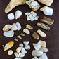 Yellowstone Country Treasure Sampler.  Natural earth items in this sampler package include:  1 large petrified wood (rough) $19.75  1 beautiful madison blue agate specimen with pockets covered in botryoidal mini crystals, $22  1 madison blue agate key chain ( medium) $6.99  1 medium petrified/agatized wood (rough) $15.75  2 small petrified wood (polished) $6  2 extra small petrified wood (polished) $4  1 XL madison blue agate (rough) $7