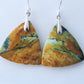 Indonesian Blue Opalized Wood Earrings with Sterling Silver, a gorgeous semi-precious gemstone! Extremely rare and lovely, Indonesian Blue Opalized Wood is a cherished material used by lapidary artists for creating stunning pieces of jewelry.  The material was first found as pebbles and rounded stones in streams and near the slopes of three volcanoes in the West Java Province.  The bail and earring wires are authentic 925 sterling silver.  Feel treasured when you wear these earrings!