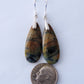 Extremely rare and lovely, Indonesian Blue Opalized Wood is a cherished material used by lapidary artists for creating stunning pieces of jewelry.  The material was first found as pebbles and rounded stones in streams and near the slopes of three volcanoes in the West Java Province. The bail and earring wires are authentic 925 sterling silver.  Feel treasured when you wear these earrings!