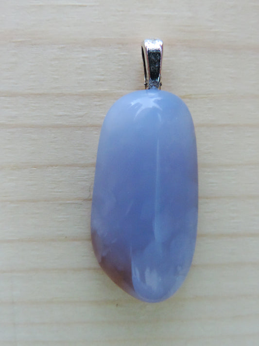 This rare stone is found in only a few locations in Montana, our material is hand collected on private property in the mountains and carried out in backpacks...each piece worth its weight in every step!  The translucent blue agate and its color variations have an alluring effect, many people find the blue agate a relaxing, calming and peaceful stone to wear.  Original and unique in design, each piece is hand crafted by lapidary artists in Montana.