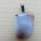 Montana Madison Blue Agate Pendant.  The stone in this pendant is a unique result of tumble shaping and polishing a piece of agate from its natural state.     This one of a kind Montana Madison Blue Agate Pendant will show off your unique taste!    