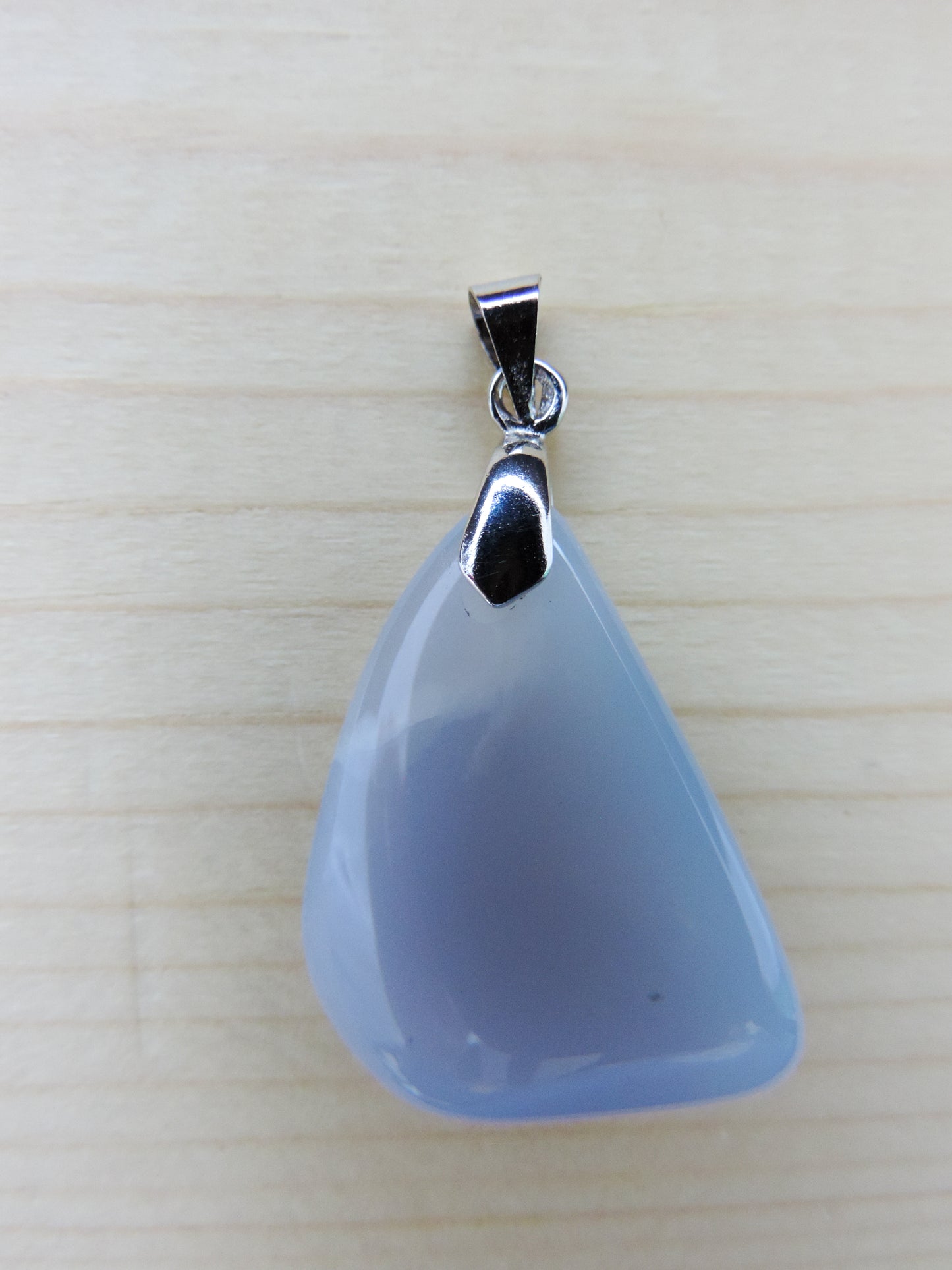 This rare stone is found in only a few locations in Montana, our material is hand collected on private property in the mountains and carried out in backpacks...each piece worth its weight in every step!  The translucent blue agate and its color variations have an alluring effect, many people find the blue agate a relaxing, calming and peaceful stone to wear.  Original and unique in design, each piece is hand crafted by lapidary artists in Montana. 