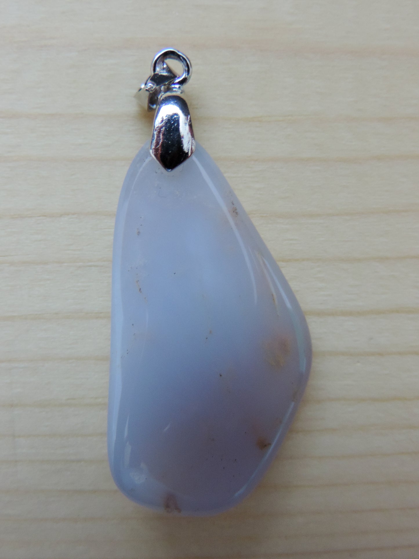 This rare stone is found in only a few locations in Montana, our material is hand collected on private property in the mountains and carried out in backpacks...each piece worth its weight in every step!  The translucent blue agate and its color variations have an alluring effect, many people find the blue agate a relaxing, calming and peaceful stone to wear.  Original and unique in design, each piece is hand crafted by lapidary artists in Montana. 