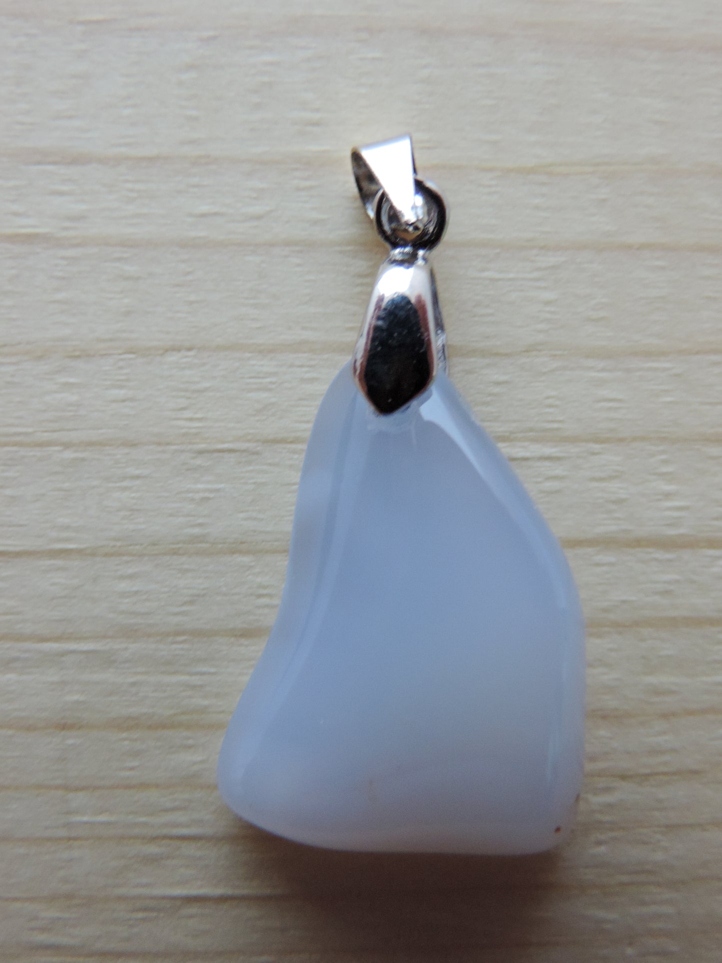 Montana Madison Blue Agate Pendant.  The stone in this pendant is a unique result of tumble shaping and polishing a piece of agate from its natural state.  